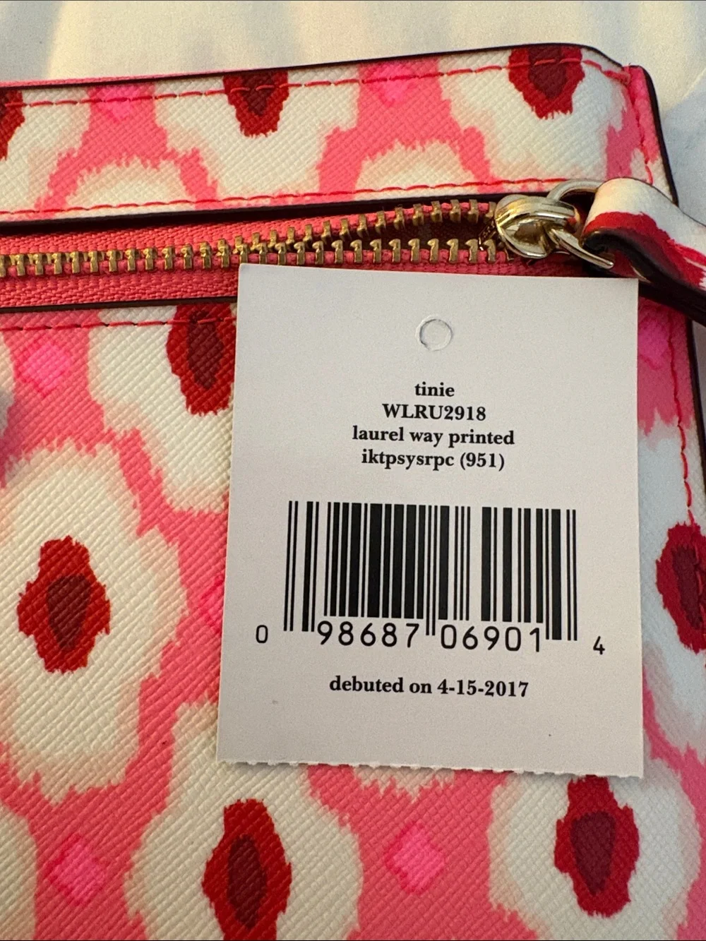 kate spade pink and white patterned wristlet clutch with gold hardware